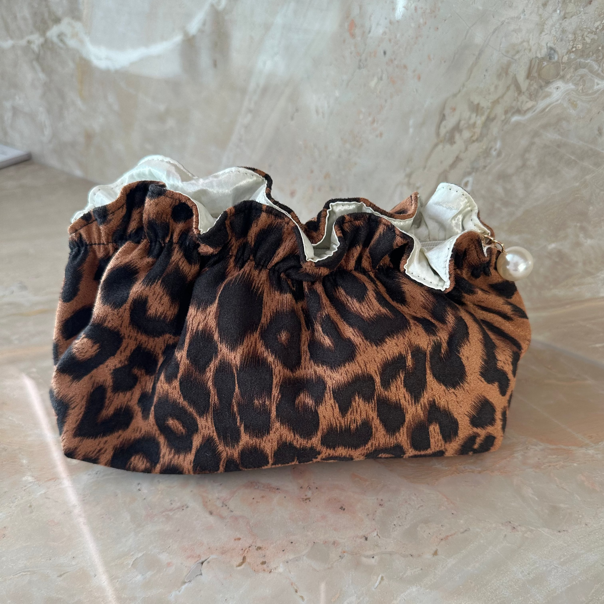 Living Beauty Leopard Ruffle Pearl Zip Clutch