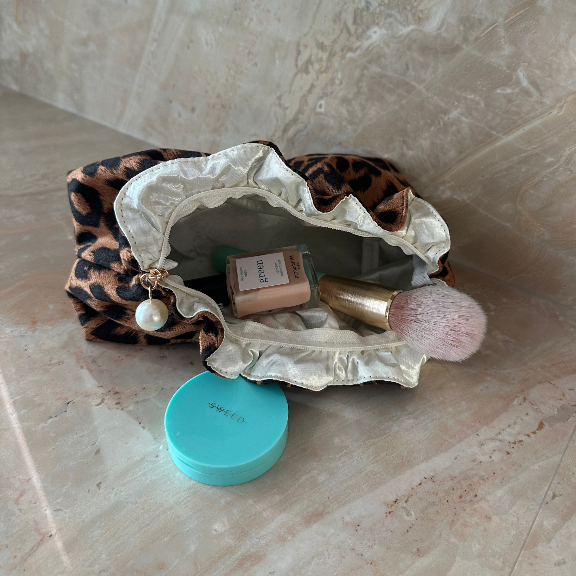 Living Beauty Leopard Ruffle Pearl Zip Clutch