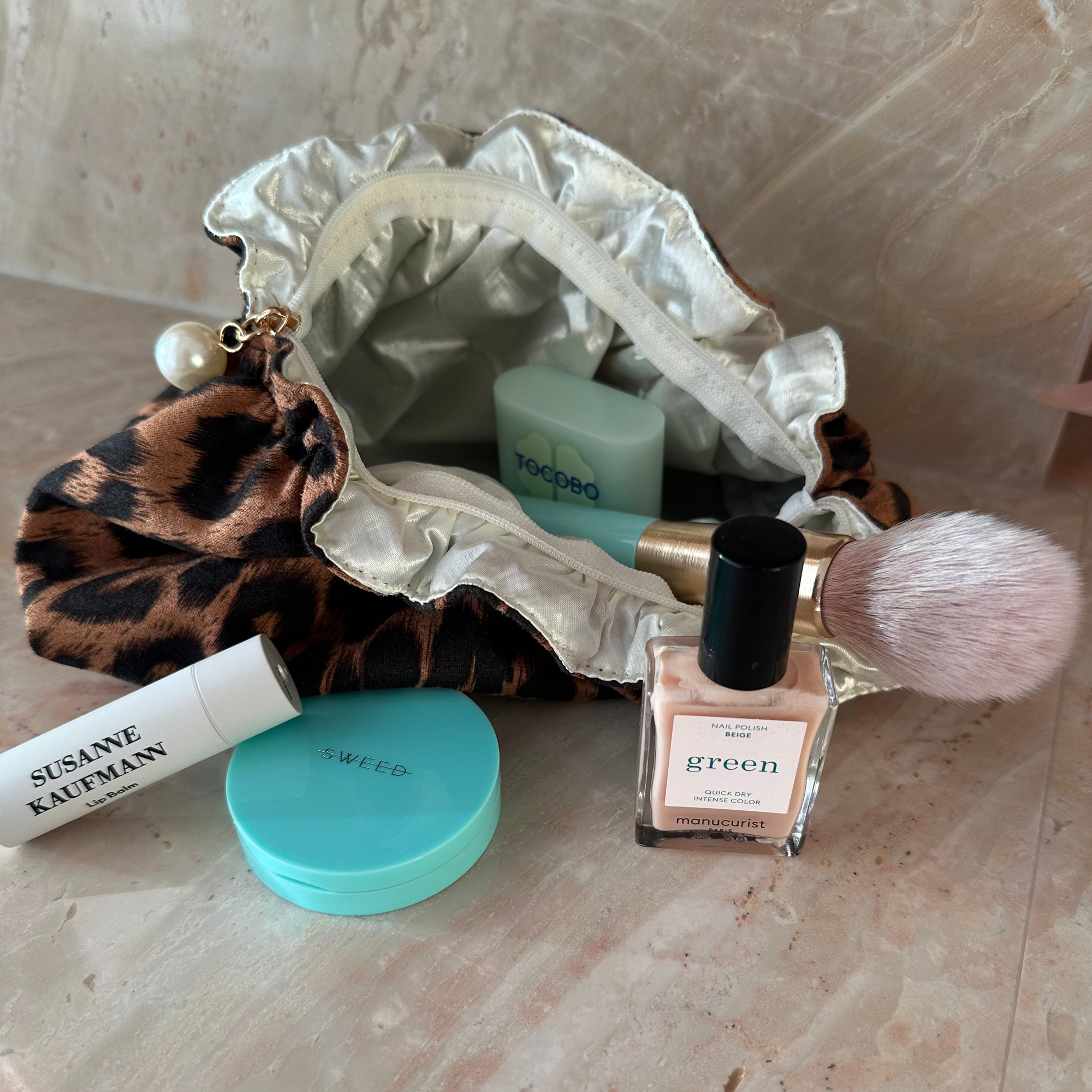 Living Beauty Leopard Ruffle Pearl Zip Clutch