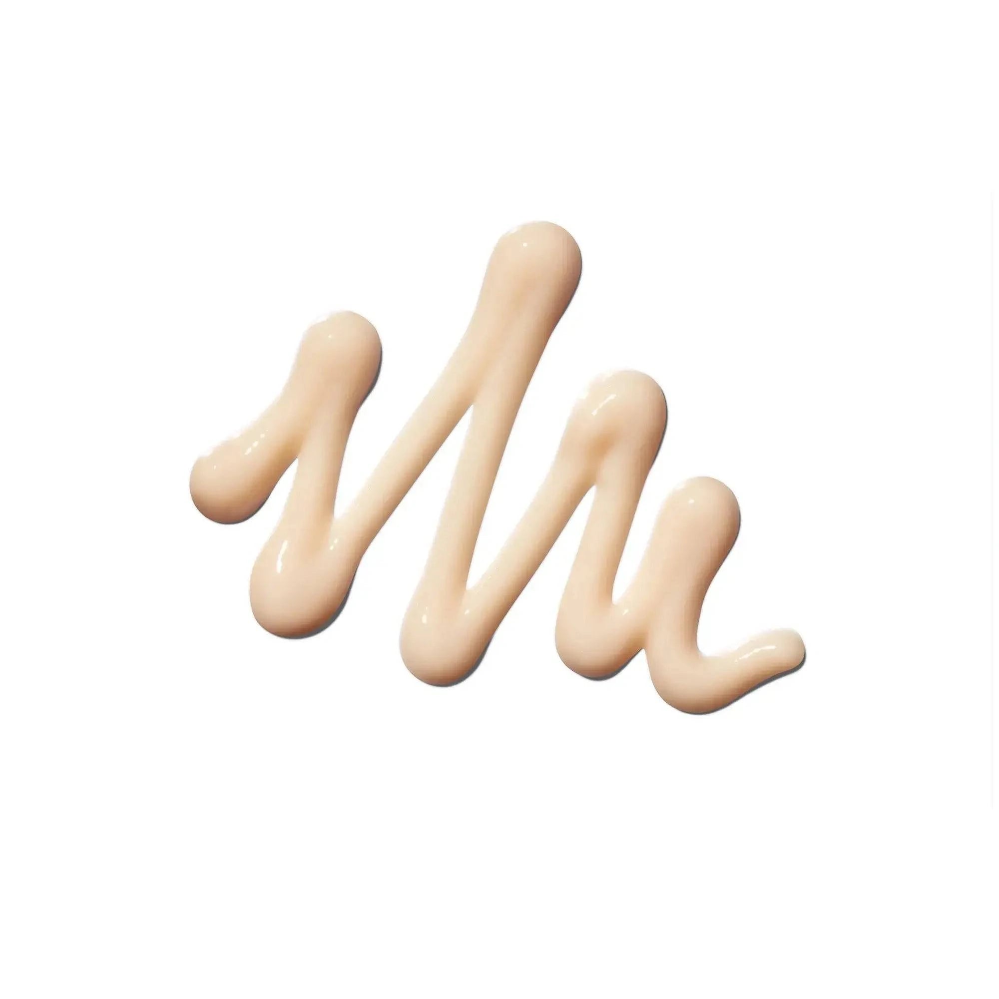 Creamy beige makeup swatch on white background - Living Beauty.