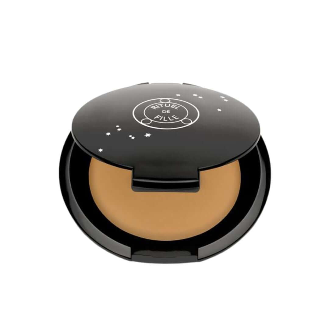 Sycorax - Medium concealer and foundation balm with yellow undertones.